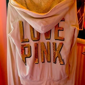 Pink brand white Sherpa jacket with gold sequins displaying logo. Size is Small